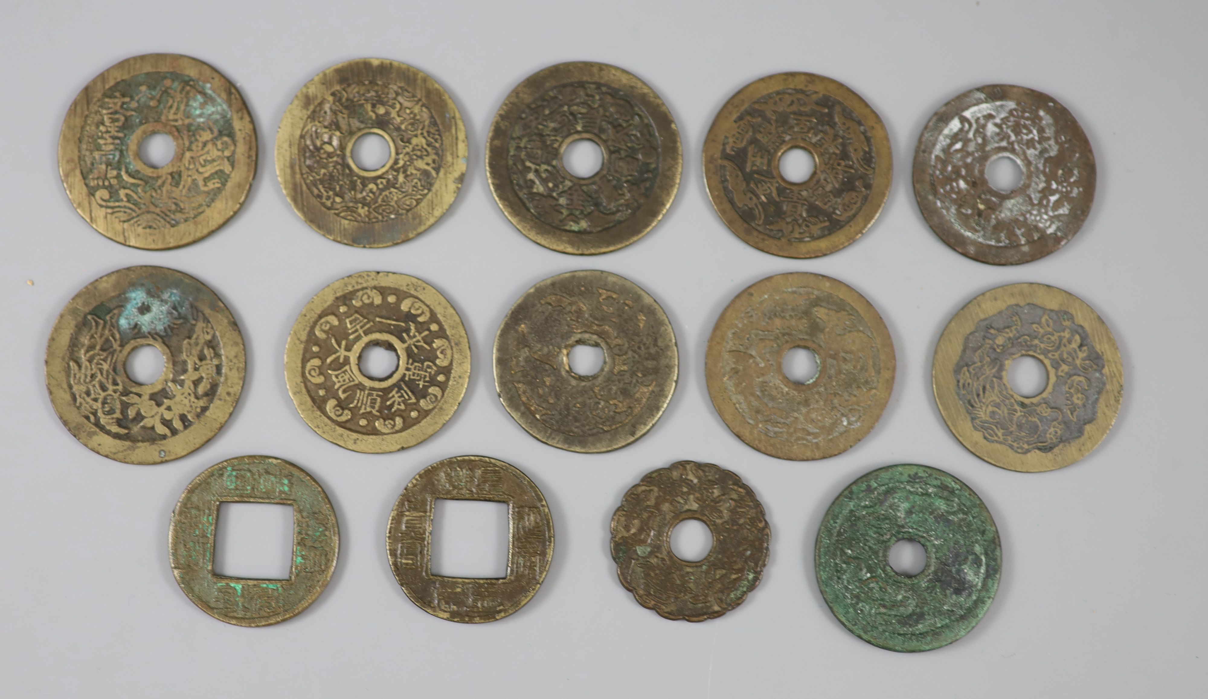China, 14 cast bronze charms or amulets, Qing dynasty,
